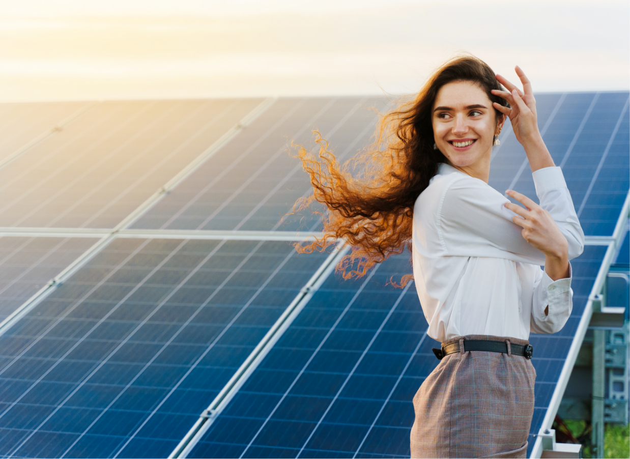 girl-standing-solar-panel-rows-during-sunset